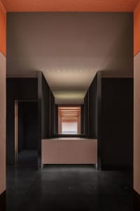 A modern interior with concrete walls and a minimalist design.