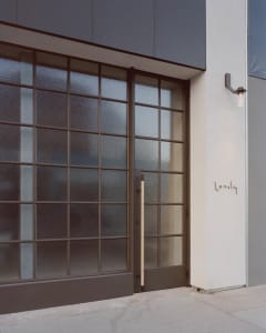 Modern entryway featuring glass panels and a minimalist design.
