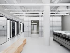 Modern retail storefront with concrete and tiled walls, minimalist design