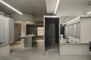 Modern retail storefront featuring contemporary design elements and concrete finishes.
