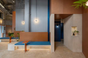 Industrial-themed coffee shop featuring concrete furnishings and minimalist design
