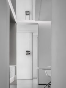 Minimalist hospitality interior featuring sleek, neutral-colored design elements.