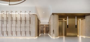 Modern lobby area with marble walls and floors