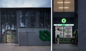 A modern storefront with a metal exterior and green logo.