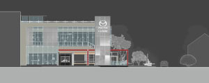 A modern commercial retail space featuring glass facade, concrete, and metal signage.