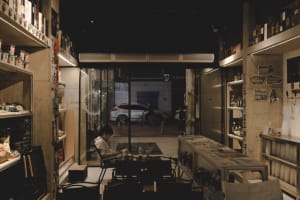 Industrial-style cafe interior with concrete walls and minimalist furniture