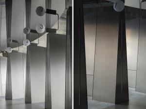Modern minimalist interior design showcasing metallic cylindrical columns