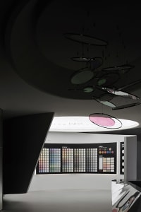 A modern interior space featuring a color chart display with various color swatches.