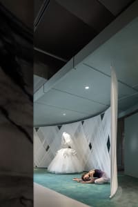 A modern installation art piece featuring fabric textiles in a contemporary setting.