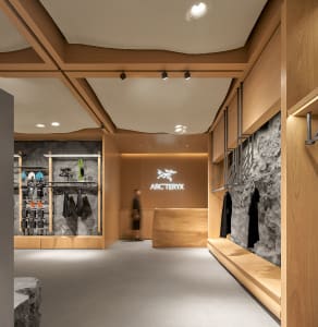 The minimalist retail space showcases sustainable wood features for eco-conscious consumers.