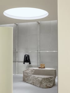 A sophisticated retail space featuring concrete materials and minimalist design