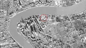 Aerial view of Shanghai with a focus on the urban layout and architectural features of the city.