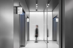 Modern fashion retail store with glass walls and metallic accents