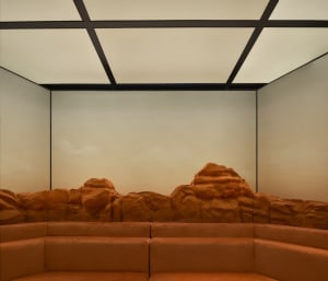 Minimalist living space featuring sandstone elements.