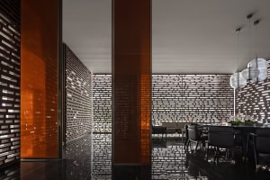 A modern interior design with brick and glass materials.
