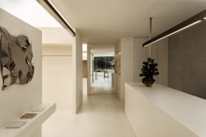 Modern minimalist interior with concrete elements, clean lines, and simplicity.