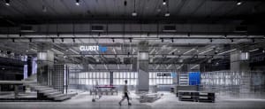 Modern, industrial-style retail space featuring concrete and glass materials.