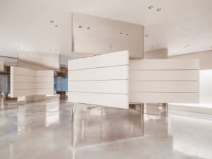 A minimalist, modern interior design featuring sleek, metallic panels.