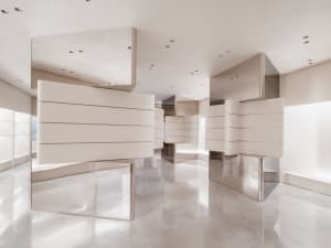 A sleek, modern storefront featuring metallic surfaces and minimalist design.