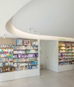 Modern baby shop interior with organized shelves displaying products.