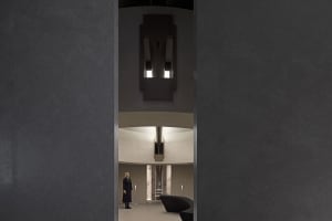 A modern industrial office space with concrete and marble finishes.