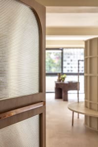 A modern office space featuring wooden furnishings.