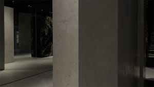Modern industrial interior space featuring exposed concrete walls and floors.