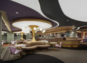 Modern restaurant cafe featuring metallic lighting, flooring, and leather furniture.
