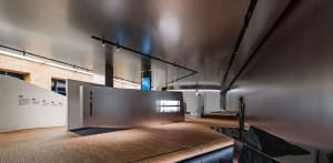 Contemporary office spaces with concrete interiors and modern design elements.