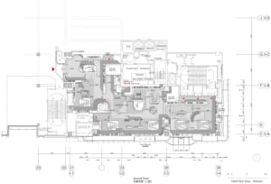A 2D rendered architectural plan of the second floor of a building, showing various rooms and spaces.