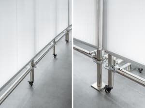An industrial space featuring metal and wheels on a concrete floor.