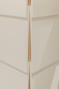 Close-up of minimalist interior design featuring wood elements