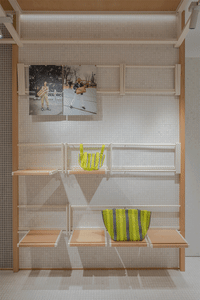 A modern retail bench constructed from wood and metal materials.