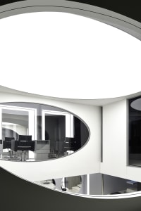 A modern interior space featuring glass elements.