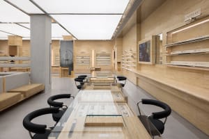 A modern retail space featuring wood and glass materials for an elegant optical store