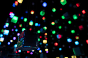 Modern, multi-colored LED lights suspended in a dark space