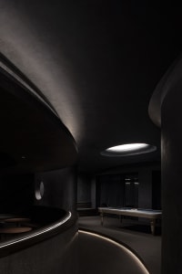 A modern interior space with concrete walls and minimalist design.