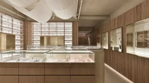 Modern retail store featuring glass displays and minimalist design.