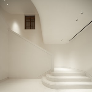Minimalist interior design featuring concrete stairs