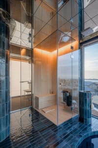 Modern bathroom with glass walls and wooden elements