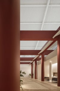Modern office space featuring industrial-style metal columns.