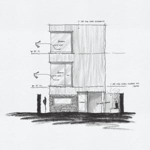 Modern residential interior featuring concrete and glass materials with a terrace