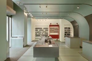 A modern retail storefront featuring concrete elements and a minimalist design.