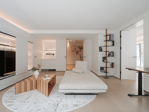 Modern minimalist living room with wood, concrete, and metal finishes