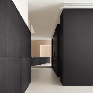 A minimalist, modern interior space featuring contemporary black and white design elements.