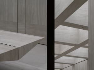 Modern minimalist interior with wooden panels and beams, showing clean lines and an open space.