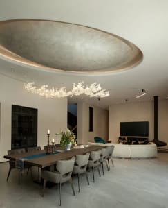 Modern dining room featuring minimalist materials and sleek design elements.