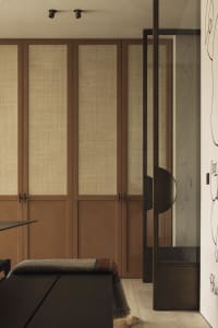 A minimalist hallway featuring wooden and glass paneling