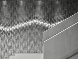 Modern industrial interior with concrete walls and geometric patterns
