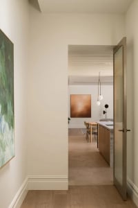 A contemporary kitchen featuring wooden cabinets and a stone countertop.